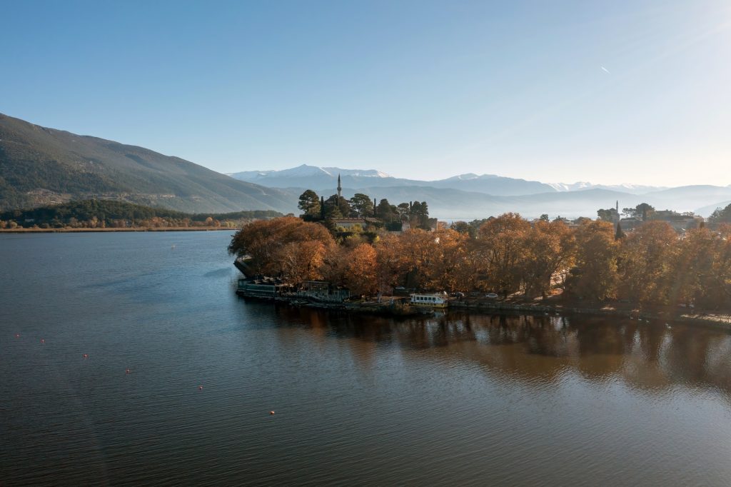 Greece, Pamvotida Lake, Giannena Epirus. Aerial drone view, blue sky background